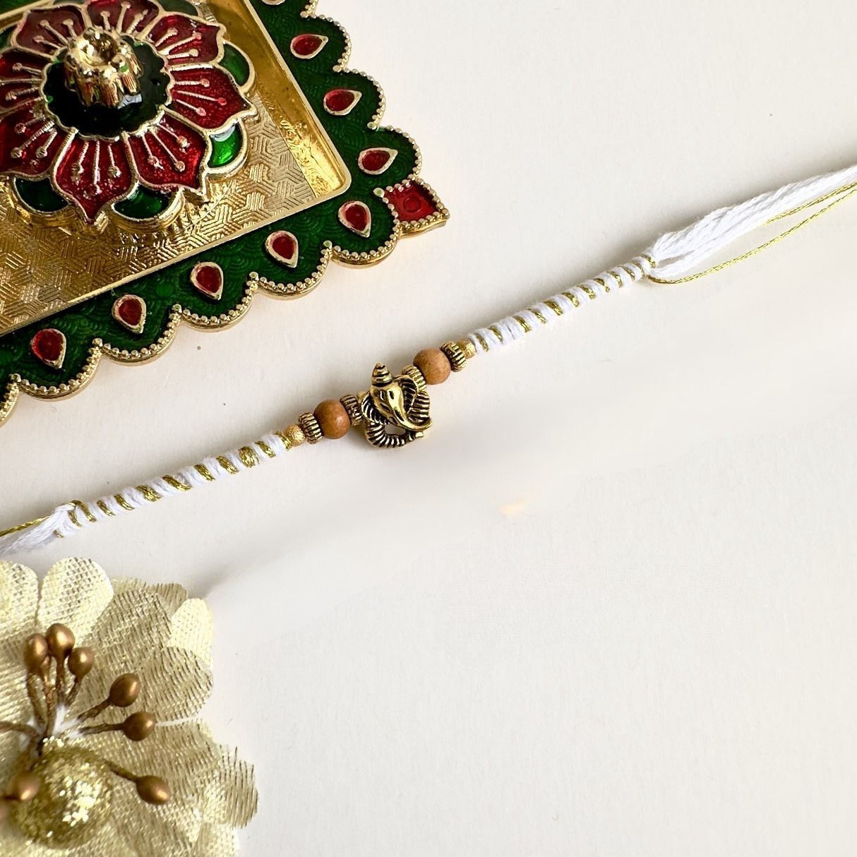 Traditional Ganesh Soft Touch Rakhi – Subtle & Beautiful